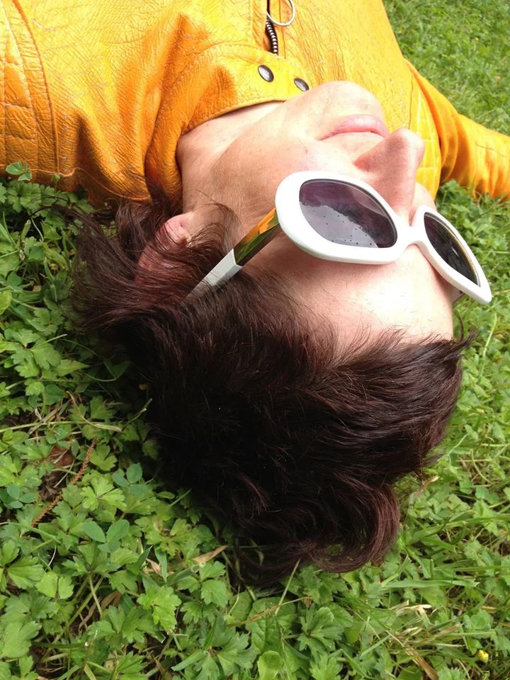 Dark hair and white sunglasses