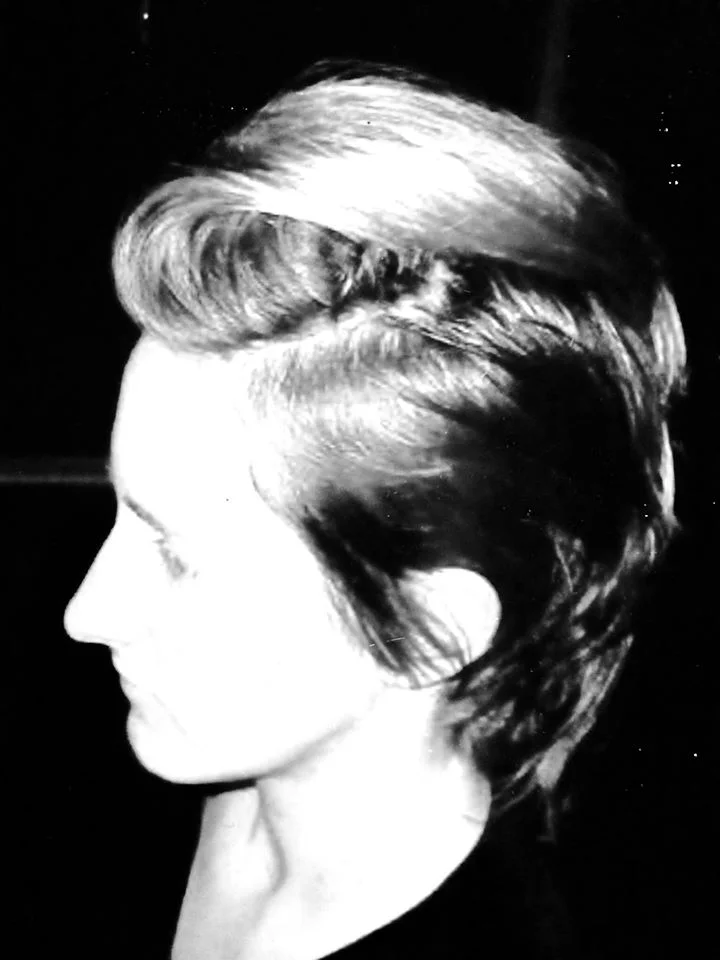 Sculpted short cut, black-and-white profile