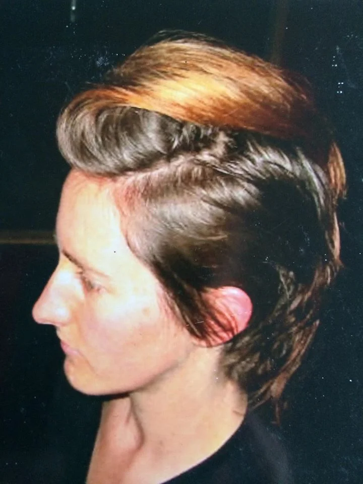 Short layered cut with a swept fringe